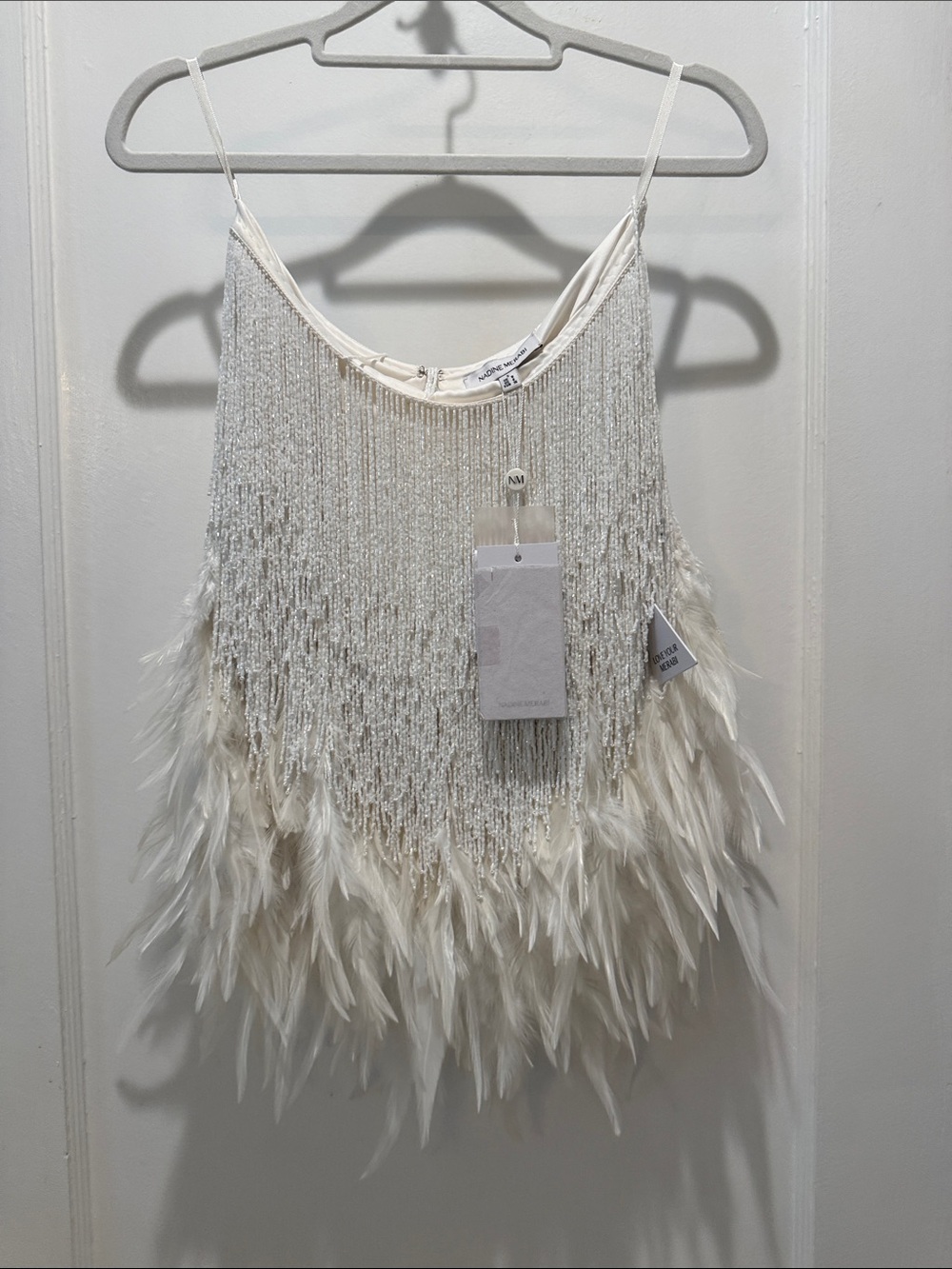 Decorative beaded and feathered garment